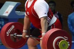 开云体育在线-包含举重选手挺拔身姿，挑战极限重量的词条